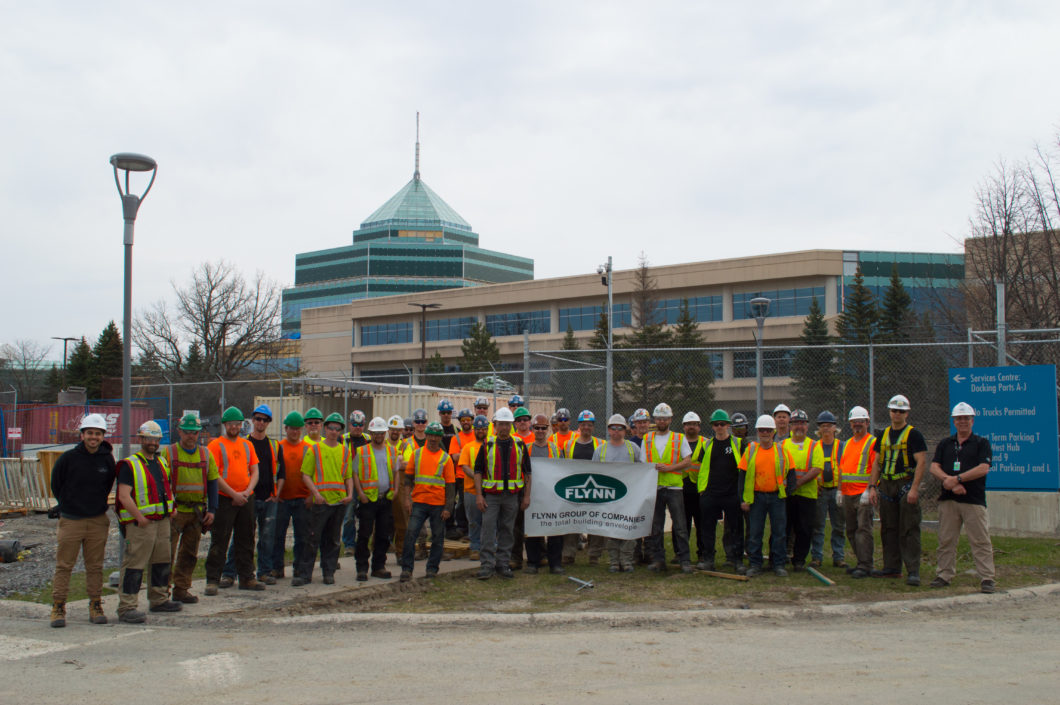 Crew photo in front of the Carling Campus project