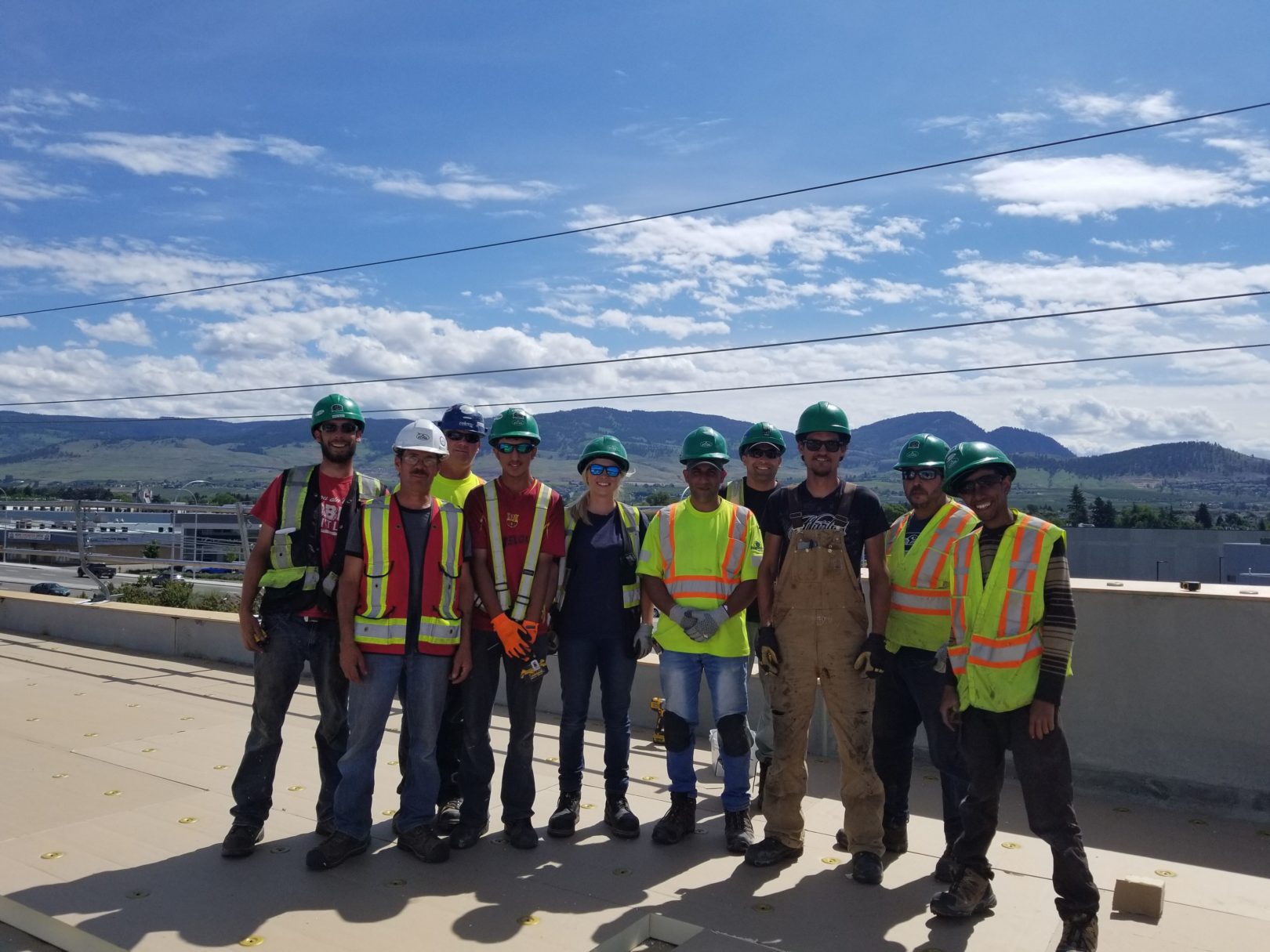 Flynn crew photo on top of roof