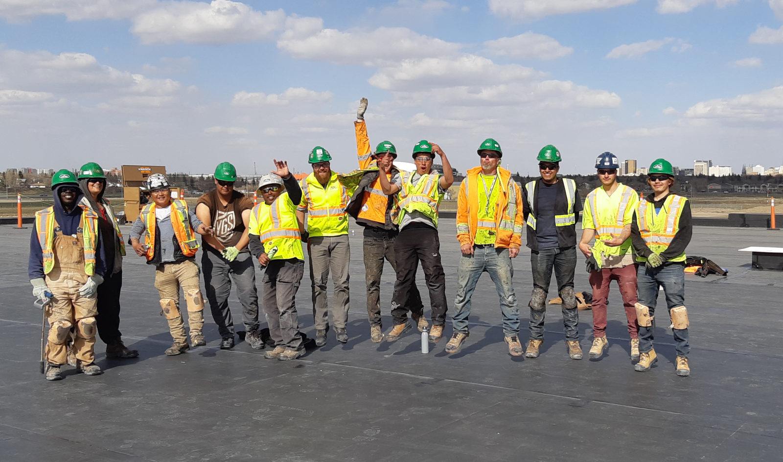 Flynn Roofing crew jumping in the air